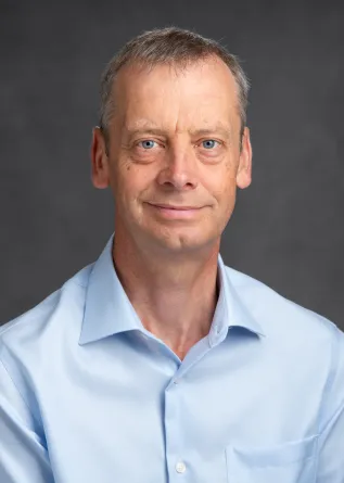 Dr. Martin Coleman confidently staring at the camera