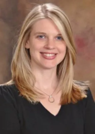 Dr. Leah Irish confidently staring at the camera