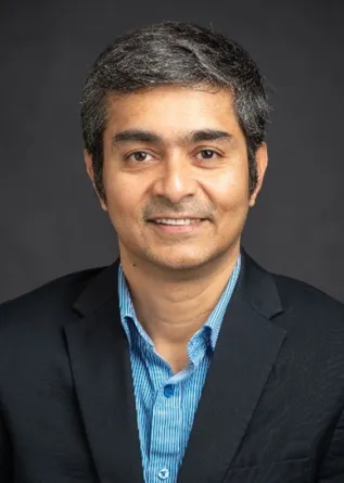 Mohiuddin Quadir smiling confidently at the camera