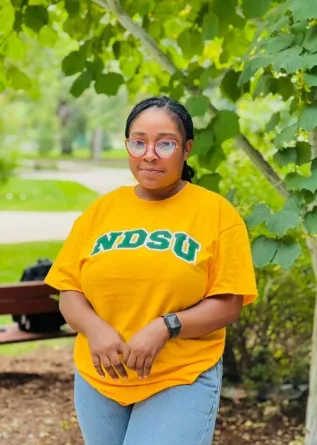 Priscilla smiling at the camera