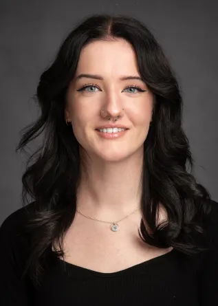 Sophia smiling at the camera