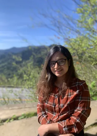 Susmita smiling at the camera