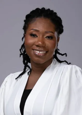 Philomena smiling at the camera