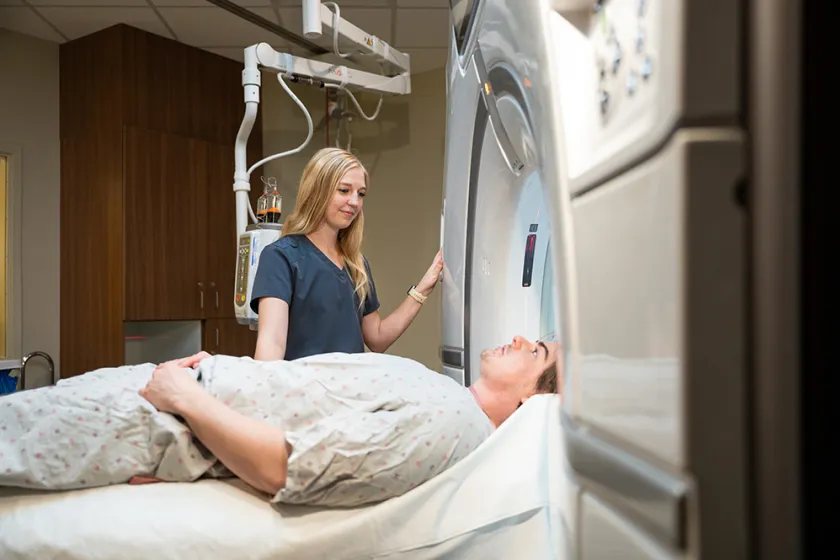 nurse performing a scan on a patient