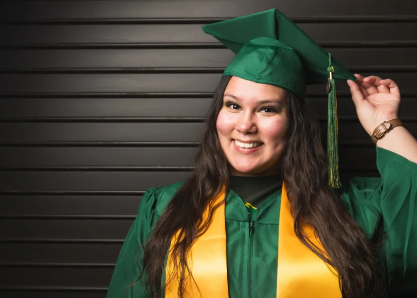 Photo of Ambrosia Yellow Bird in her cap and gown.
