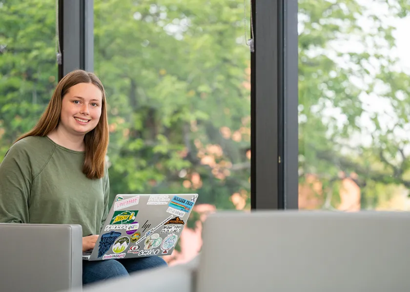 Computer science Kaylee Swenson sitting in study lounge