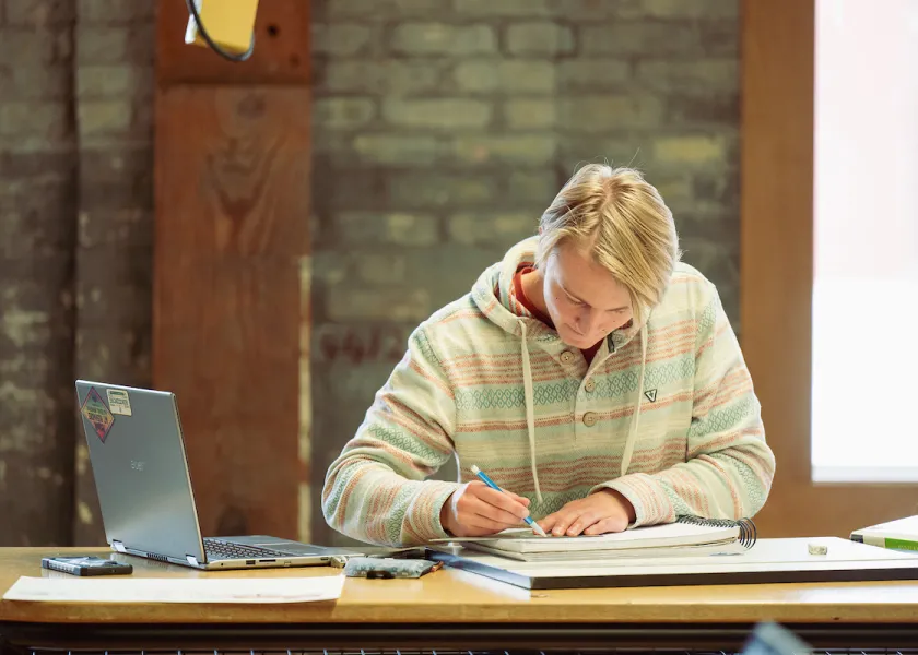 An NDSU student studying
