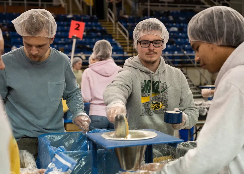 NDSU students volunteering at Feed My Starving Children