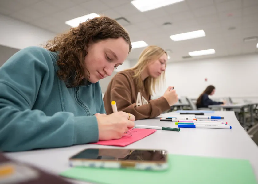 NDSU students writing letters to children