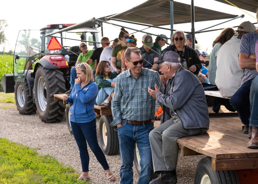 NDSU President David Cook talks chats with a community member during Casselton Field Day