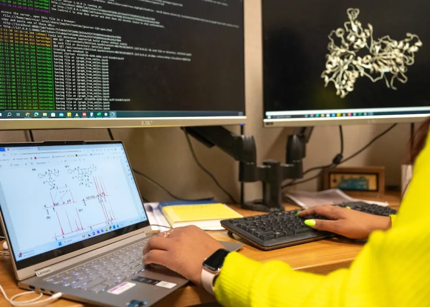 A photo of NDSU student conducting research on computer