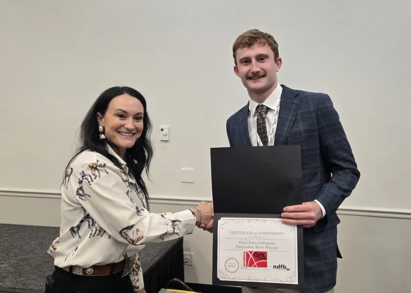 NDSU student Alex Huber receiving his victory certificate