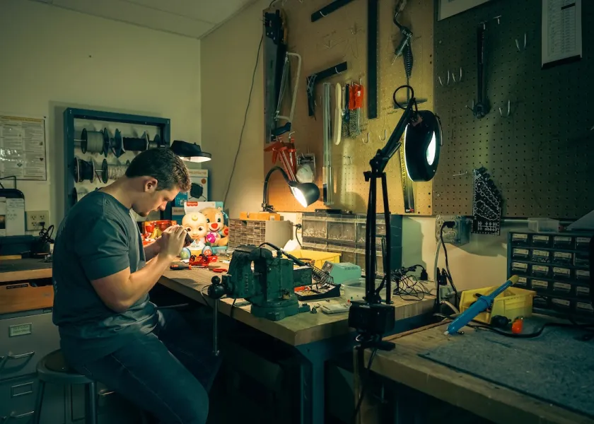 An NDSU student working on making a children's toy more accessible.