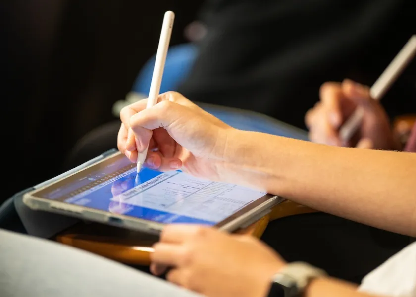 a student working on a tablet in class