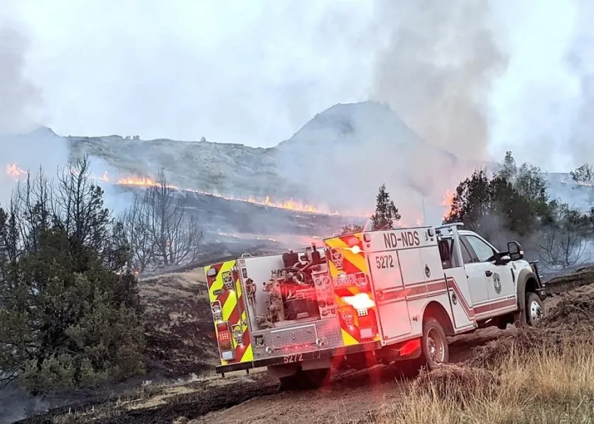 a NDSU-North Dakota Forest Service truck near a wildfire