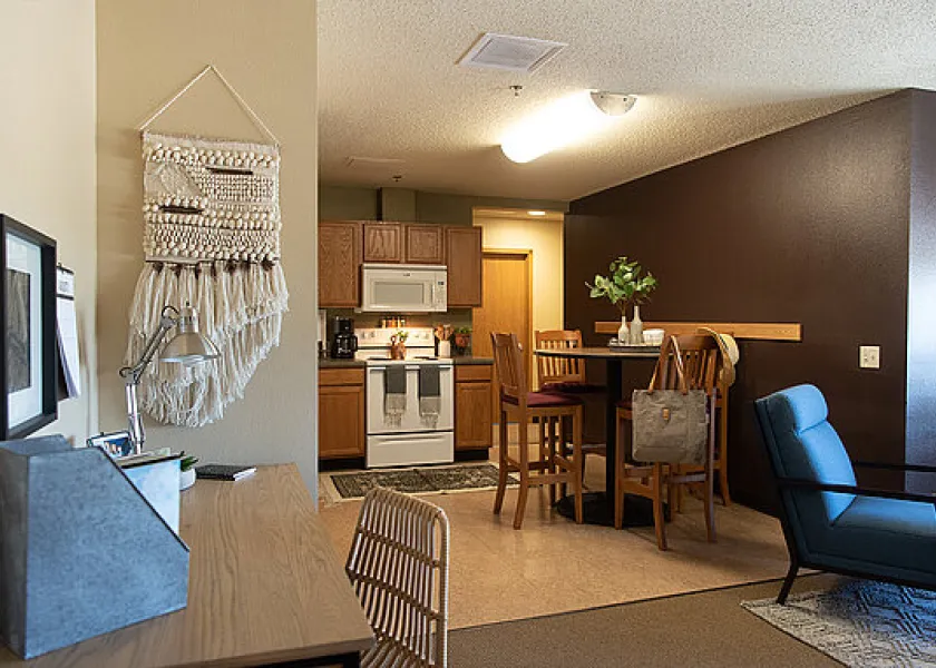 Dining room and kitchen in apartment-style campus housing