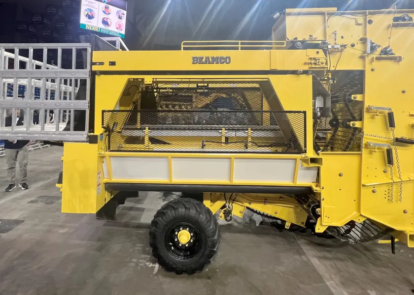 a yellow custom-built sugar beet harvester sitting in the Fargodome