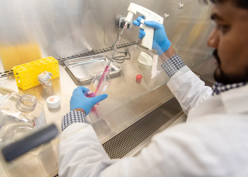 student performing a experiment in a lab