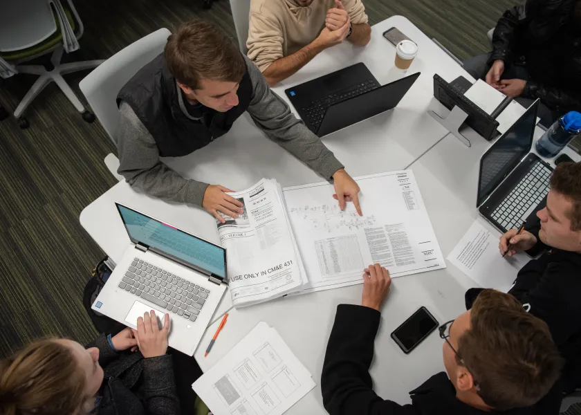 students work together on construction project