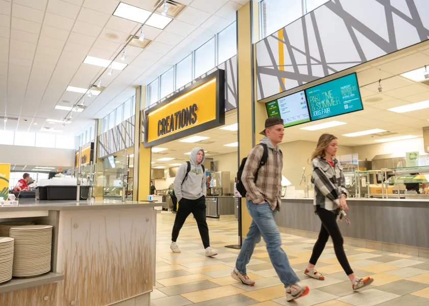 Residence Dining Center three people walking