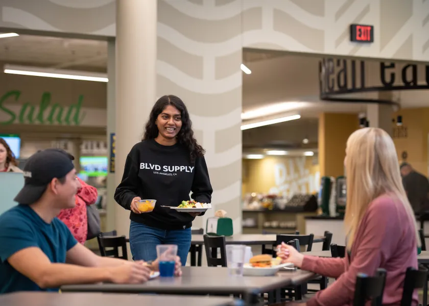 Students gathering at dining hall for a meal