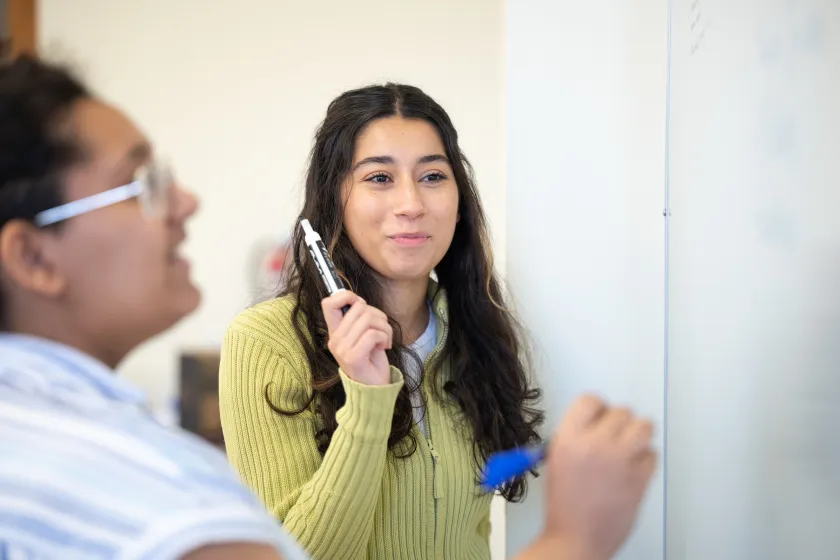 students working at a white board