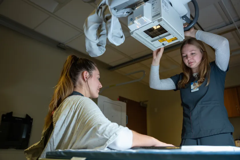 Radiologic Science student taking an x-ray during class