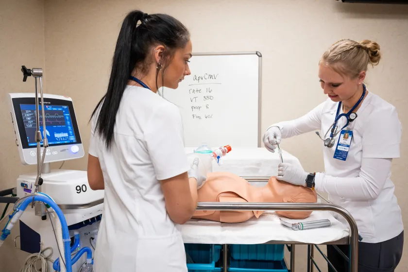 Respiratory Care students practicing procedures on a mannequin