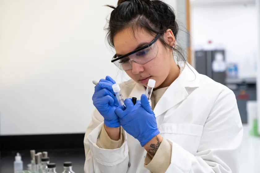 student working with samples in a lab