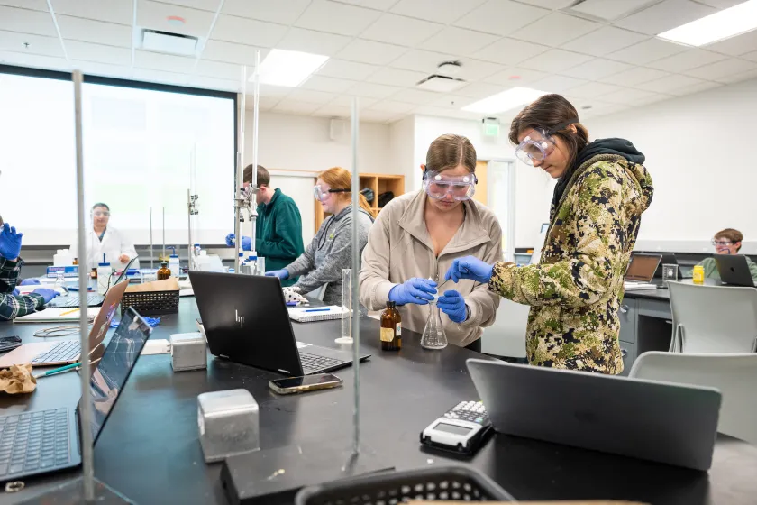 students performing experiments in a lab