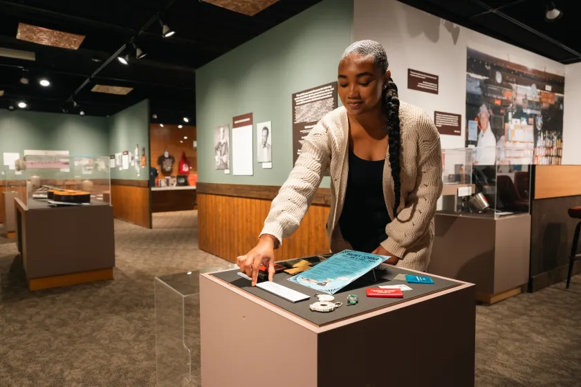 student positioning artifacts for an exhibit in a museum