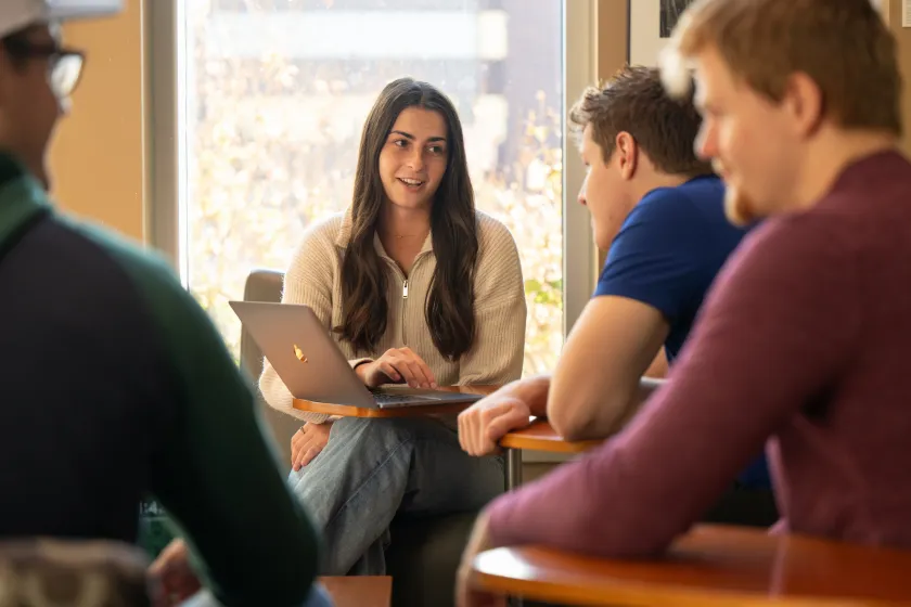 Business students discussing their classwork