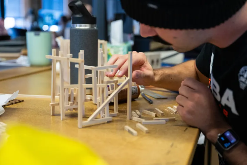 student building an architectural model