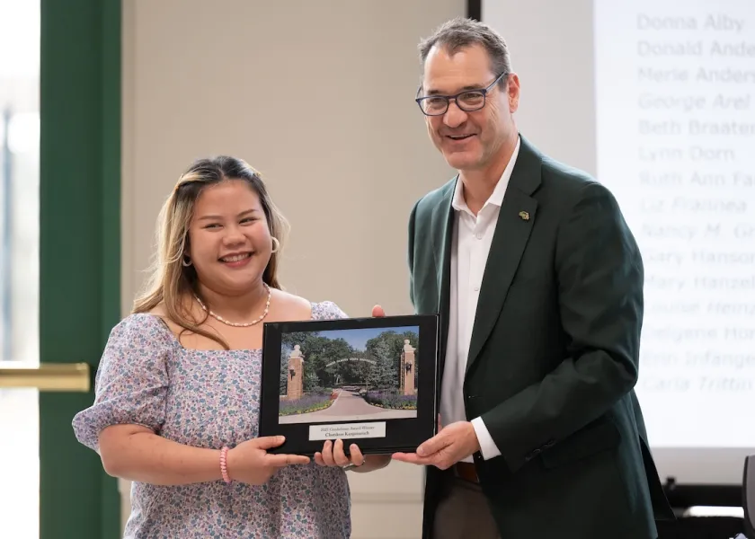 Gunkelman Award winner Chutikun “Chuti” Kanjanaruch and NDSU President David Cook