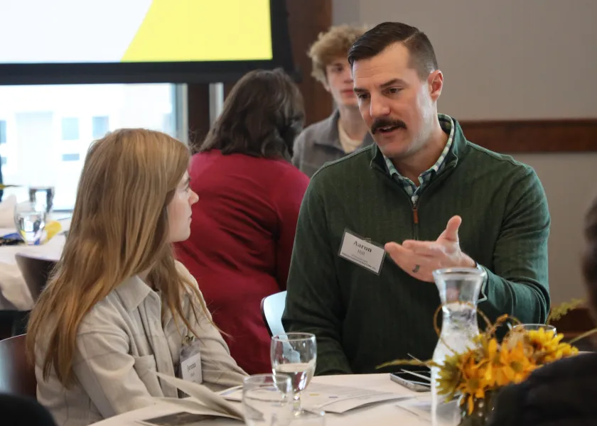 Business Connections pair talking.