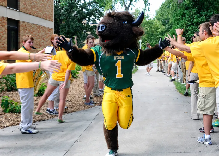 Thundar high-fiving students