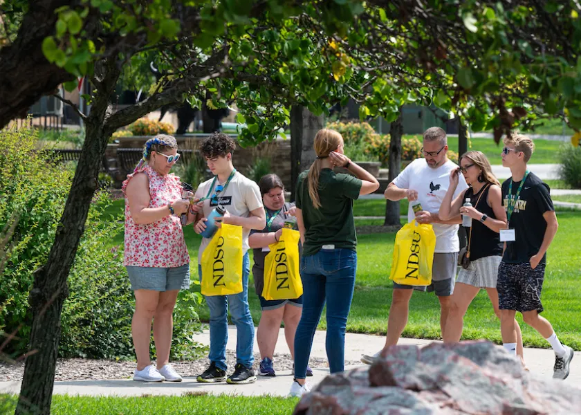 students and families being led on a campus tour
