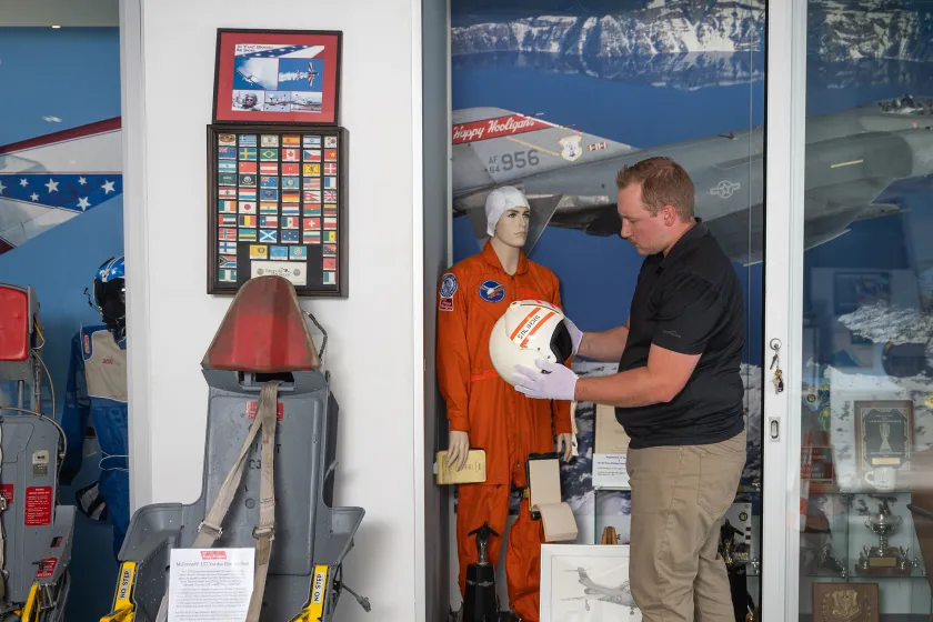 student working at Fargo Air Museum with historical memorabilia