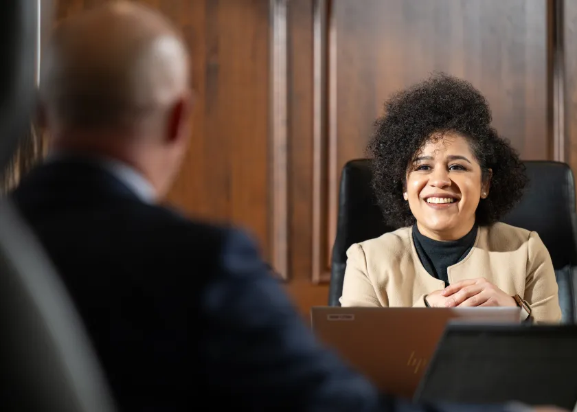 grad student visiting with business professional
