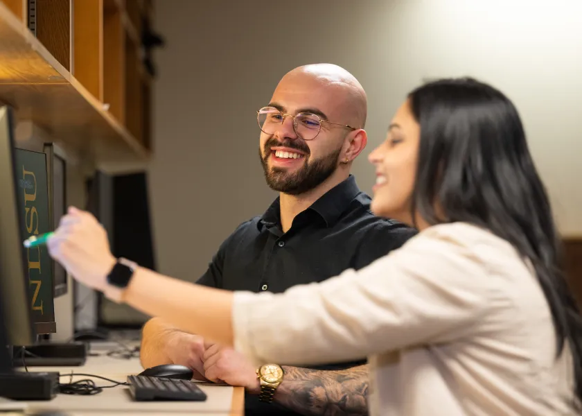 students working together at the Grad Hub in the Library