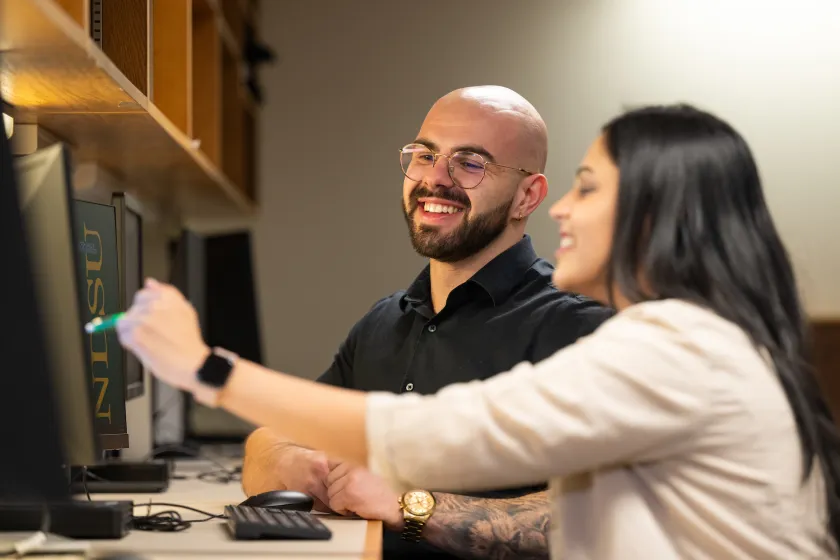 students working together at the Grad Hub in the Library