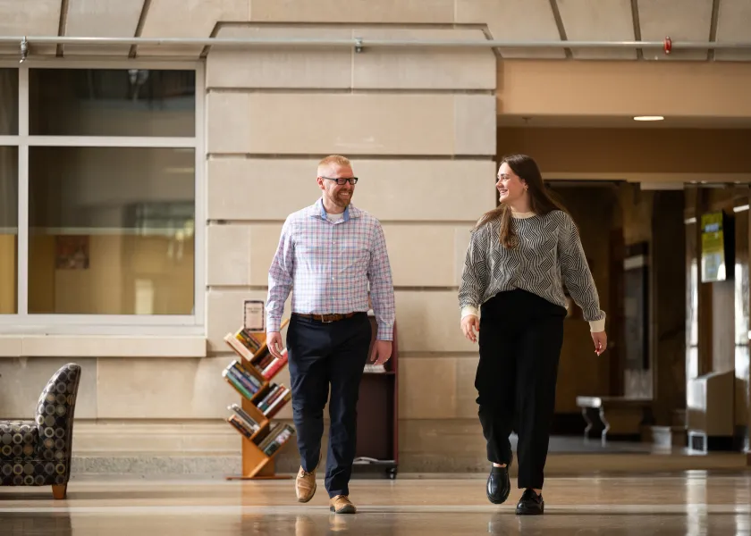 Advisor and student walking in Barry Hall