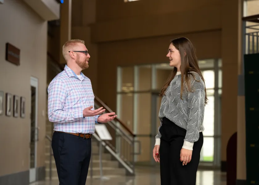 advisor Brad Jones talking with student Morgan Middleton