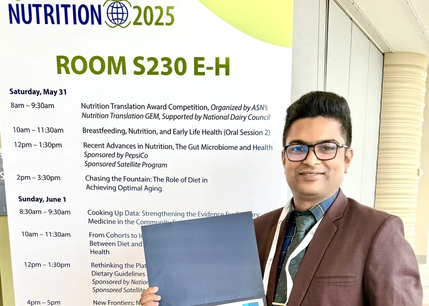 Najmol Hoque, a doctoral student in the NDSU plant sciences department, holds his award.