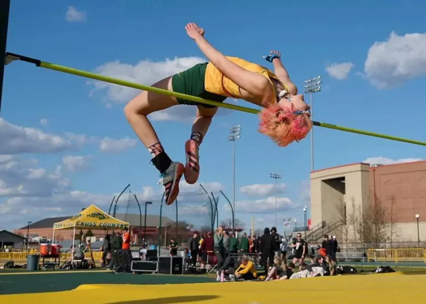 Women's track athlete in high jump.