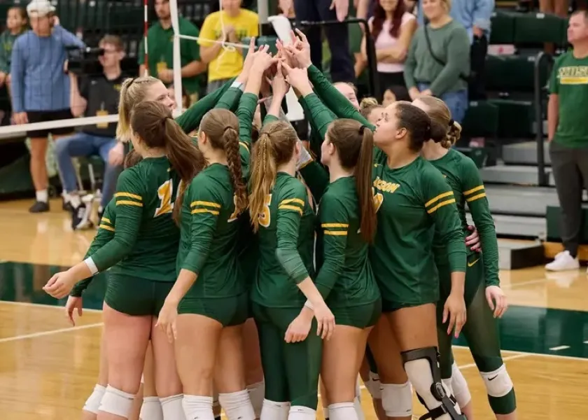 NDSU volleyball players celebrate.