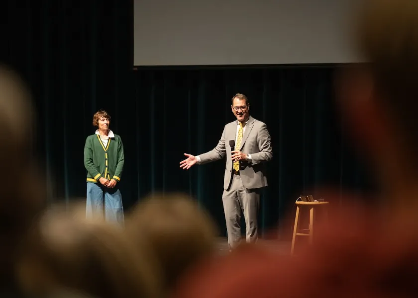 President David Cook and wife Kate Cook on stage at Welcome to the Academy.