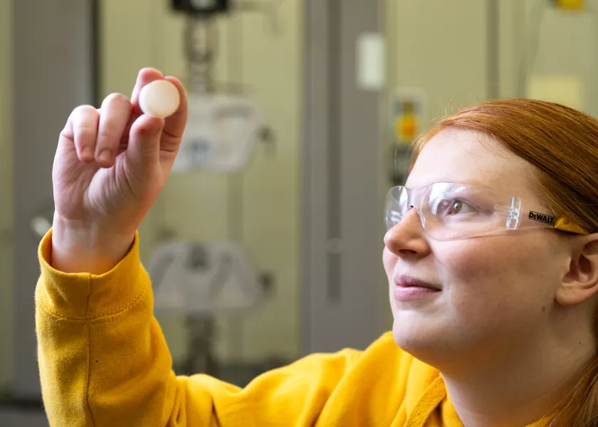undergraduate researcher works in lab