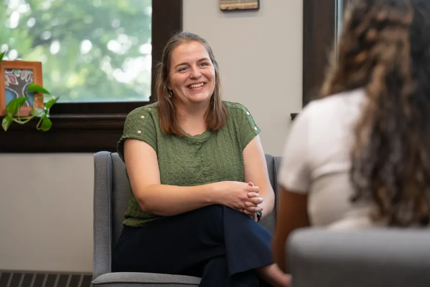 Shellie, Beeker, the director of NDSU's Counseling Center sits in her office while listening to a student.