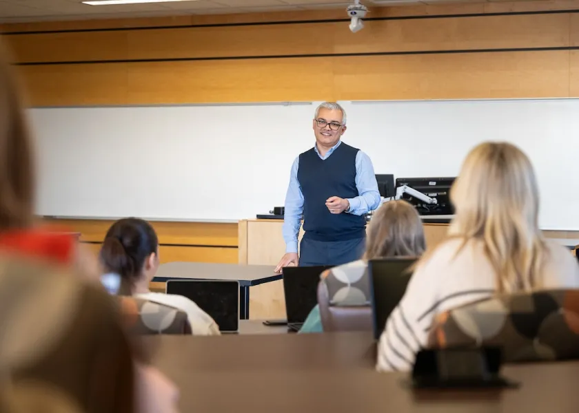 Finance department chair Fariz Huseynov teaching in class.